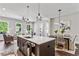 Kitchen island with seating overlooks dining and living areas, creating an inviting and connected living space at 2144 Tidwell Ln # 2, Atlanta, GA 30318