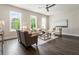 Bright and airy living room with hardwood floors, stylish seating, and large windows at 2144 Tidwell Ln # 2, Atlanta, GA 30318