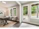 Bright office features natural light, contemporary furnishings, and a view of the outdoors at 2144 Tidwell Ln # 2, Atlanta, GA 30318