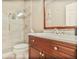 Elegant bathroom featuring modern glass shower and marble countertops on wood vanity at 7249 Village Creek Trce, Atlanta, GA 30328