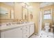 Bright bathroom featuring a double sink vanity with a neutral color scheme at 7249 Village Creek Trce, Atlanta, GA 30328