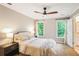 Comfortable bedroom with neutral decor, large windows, and ample natural light at 7249 Village Creek Trce, Atlanta, GA 30328