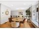 Open-concept dining room featuring hardwood floors and neutral color palette at 7249 Village Creek Trce, Atlanta, GA 30328