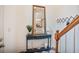 Inviting entryway with stylish console table, elegant mirror, and convenient coat rack at 7249 Village Creek Trce, Atlanta, GA 30328