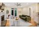 Bright living room with fireplace, French doors, and hardwood floors, creating an inviting space at 7249 Village Creek Trce, Atlanta, GA 30328