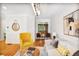 Cozy living room with hardwood floors, a fireplace, and a large window at 7249 Village Creek Trce, Atlanta, GA 30328