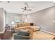 Comfortable living room featuring plush seating, stylish rug, and lots of light at 7249 Village Creek Trce, Atlanta, GA 30328