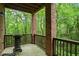 Outdoor patio featuring barbecue grill with view of wooded scenery at 7249 Village Creek Trce, Atlanta, GA 30328