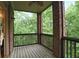 Outdoor patio with wood flooring and a wooded view at 7249 Village Creek Trce, Atlanta, GA 30328