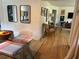 Open-concept dining area with modern furniture, a glass table, and hardwood floors at 1038 Ralph Ne Rd, Atlanta, GA 30324