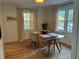 Cozy dining room featuring a glass table, modern chairs, and natural light from large windows at 1038 Ralph Ne Rd, Atlanta, GA 30324