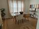 Bright dining area with a glass table, stylish chairs, and a decorative bar cart at 1038 Ralph Ne Rd, Atlanta, GA 30324