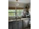 Functional kitchen featuring stainless steel appliances, a sink, and granite countertops at 1038 Ralph Ne Rd, Atlanta, GA 30324