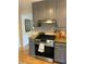 Well-equipped kitchen with granite countertops, stainless steel appliances, and blue cabinets at 1038 Ralph Ne Rd, Atlanta, GA 30324