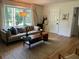 Cozy living room featuring hardwood floors, a large window, and stylish decor at 1038 Ralph Ne Rd, Atlanta, GA 30324
