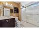 Bathroom with a vanity, toilet, and a bathtub with a shower and sliding doors at 109 Windcroft Nw Cir, Acworth, GA 30101