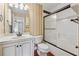 Bathroom with a vanity, toilet, and a bathtub with a shower and sliding doors at 109 Windcroft Nw Cir, Acworth, GA 30101