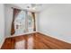 This bedroom features gleaming hardwood floors and bright windows with curtains at 109 Windcroft Nw Cir, Acworth, GA 30101