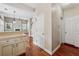 Inviting entryway with hardwood floors leading to a living room with a fireplace, and a glimpse of the staircase at 109 Windcroft Nw Cir, Acworth, GA 30101