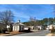 Charming community entrance with guard house and well-maintained landscaping at 109 Windcroft Nw Cir, Acworth, GA 30101