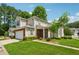 Charming two-story home with well-manicured lawn and inviting curb appeal on a sunny day at 109 Windcroft Nw Cir, Acworth, GA 30101