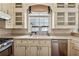 Kitchen featuring neutral cabinets, stainless steel appliances, and tile backsplash at 109 Windcroft Nw Cir, Acworth, GA 30101
