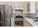 Kitchen area featuring neutral cabinets and stainless steel appliances, offering a functional layout at 109 Windcroft Nw Cir, Acworth, GA 30101