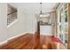 Comfortable living space with beautiful hardwood floors, stairs, with view into the kitchen at 109 Windcroft Nw Cir, Acworth, GA 30101