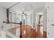 A loft space with hardwood floors, built-in bookshelves, and a ceiling fan at 109 Windcroft Nw Cir, Acworth, GA 30101