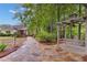 Stone path leading to a swing set, enhancing the backyard's beauty and tranquility with its natural elements at 1152 Ward Creek Sw Dr, Marietta, GA 30064