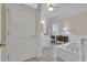 Elegant bathroom featuring a soaking tub, custom vanity, and natural light at 1152 Ward Creek Sw Dr, Marietta, GA 30064