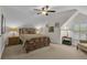 Spacious bedroom featuring neutral tones, lamps, and framed art at 1152 Ward Creek Sw Dr, Marietta, GA 30064