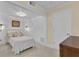 Cozy bedroom with a bed, framed artwork, sconces, and white trim at 1152 Ward Creek Sw Dr, Marietta, GA 30064