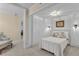 Bedroom showcasing white trim and a sitting area with floral armchair at 1152 Ward Creek Sw Dr, Marietta, GA 30064