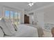 Inviting bedroom with a comfortable bed, side table, and a large window with shutters at 1152 Ward Creek Sw Dr, Marietta, GA 30064