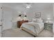 Cozy bedroom with a queen-size bed, dresser, and windows for natural light at 1152 Ward Creek Sw Dr, Marietta, GA 30064