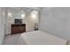 Bright bedroom with a ceiling fan, sconces, TV, and neutral carpet at 1152 Ward Creek Sw Dr, Marietta, GA 30064