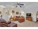 Cozy bonus room featuring comfortable seating, a ceiling fan, wainscoting, and a television at 1152 Ward Creek Sw Dr, Marietta, GA 30064