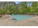 Relaxing community pool area surrounded by lounge chairs, offering a perfect spot for relaxation at 1152 Ward Creek Sw Dr, Marietta, GA 30064