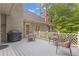 Outdoor deck with patio furniture, a barbecue grill, and overlooking the landscaped yard at 1152 Ward Creek Sw Dr, Marietta, GA 30064