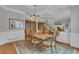 Elegant dining room with a mirrored wall and classic decor, creating a sophisticated dining experience at 1152 Ward Creek Sw Dr, Marietta, GA 30064