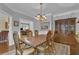 Traditional dining room featuring hardwood floors, chandelier lighting, and elegant wood china cabinet at 1152 Ward Creek Sw Dr, Marietta, GA 30064