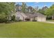 Charming home featuring a well-manicured lawn and a two-car garage, enhancing its curb appeal at 1152 Ward Creek Sw Dr, Marietta, GA 30064