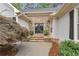 Elegant stone entryway with double doors and manicured landscaping, creating a welcoming entrance at 1152 Ward Creek Sw Dr, Marietta, GA 30064