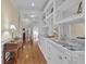 Hallway featuring white cabinets with marble countertop and gold hardware at 1152 Ward Creek Sw Dr, Marietta, GA 30064