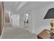Hallway with stairs and french doors that lead into a room with luxury design at 1152 Ward Creek Sw Dr, Marietta, GA 30064