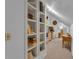 Hallway featuring built-in shelving with books and items at 1152 Ward Creek Sw Dr, Marietta, GA 30064
