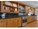 Gourmet kitchen features modern stainless steel appliances, and dark granite countertops at 1152 Ward Creek Sw Dr, Marietta, GA 30064