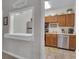 Efficient kitchen features stainless steel appliances and a pass-through to the dining area at 1152 Ward Creek Sw Dr, Marietta, GA 30064