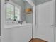 Neat laundry room with washer, dryer, and a window for natural light at 1152 Ward Creek Sw Dr, Marietta, GA 30064